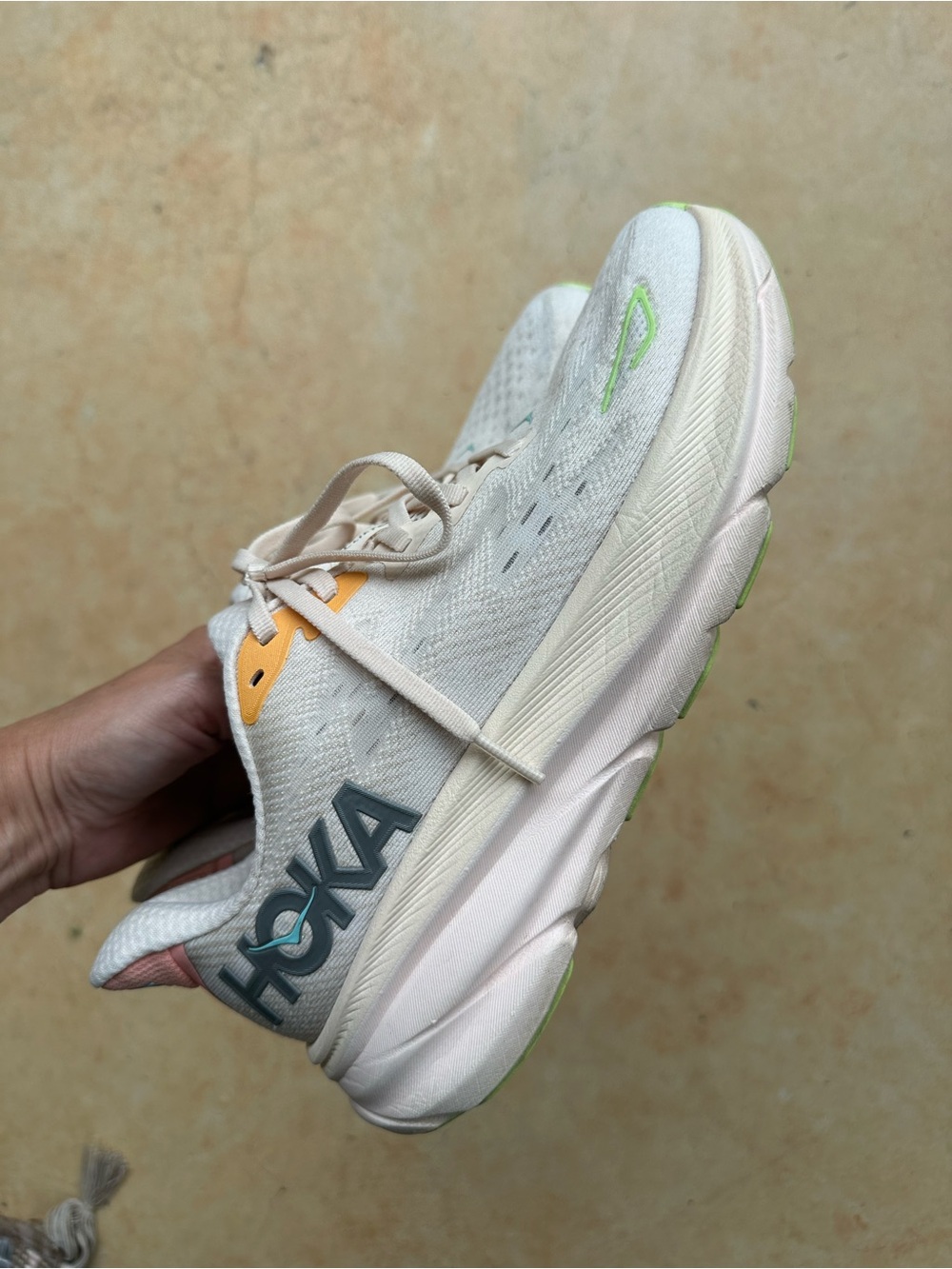 Hoka Neutral Running Shoe in Cream with Lime and Orange Accents